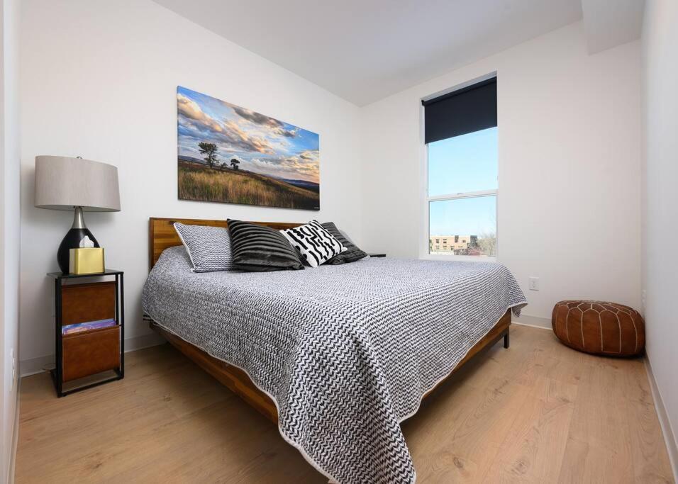 Cozy bedroom with mountain-view windows in a Bozeman vacation rental