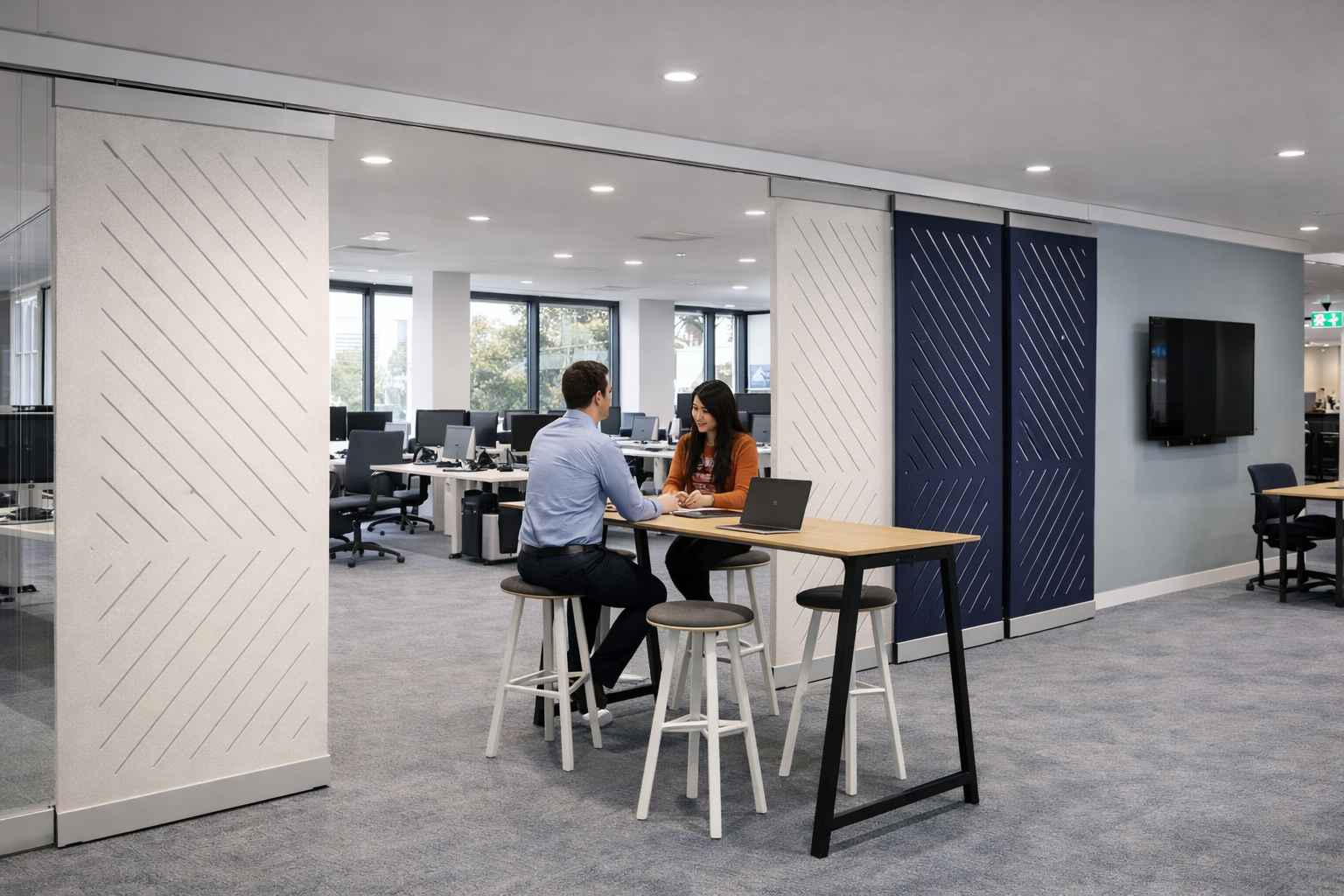 PanelHush PET sliding panels creating a private meeting room alongside an open-plan office
