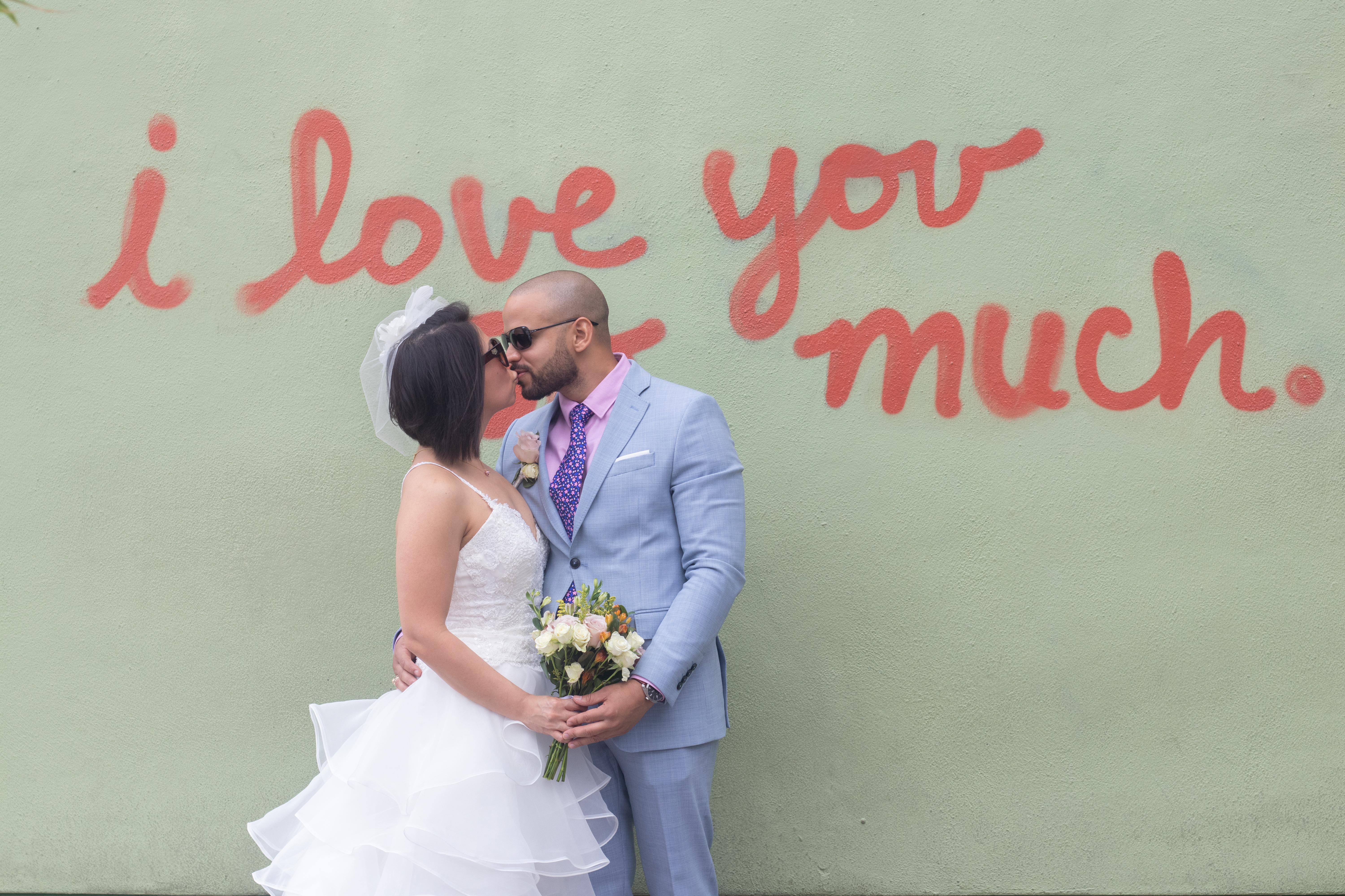 Romantic elopement detail — bride and groom hand in hand