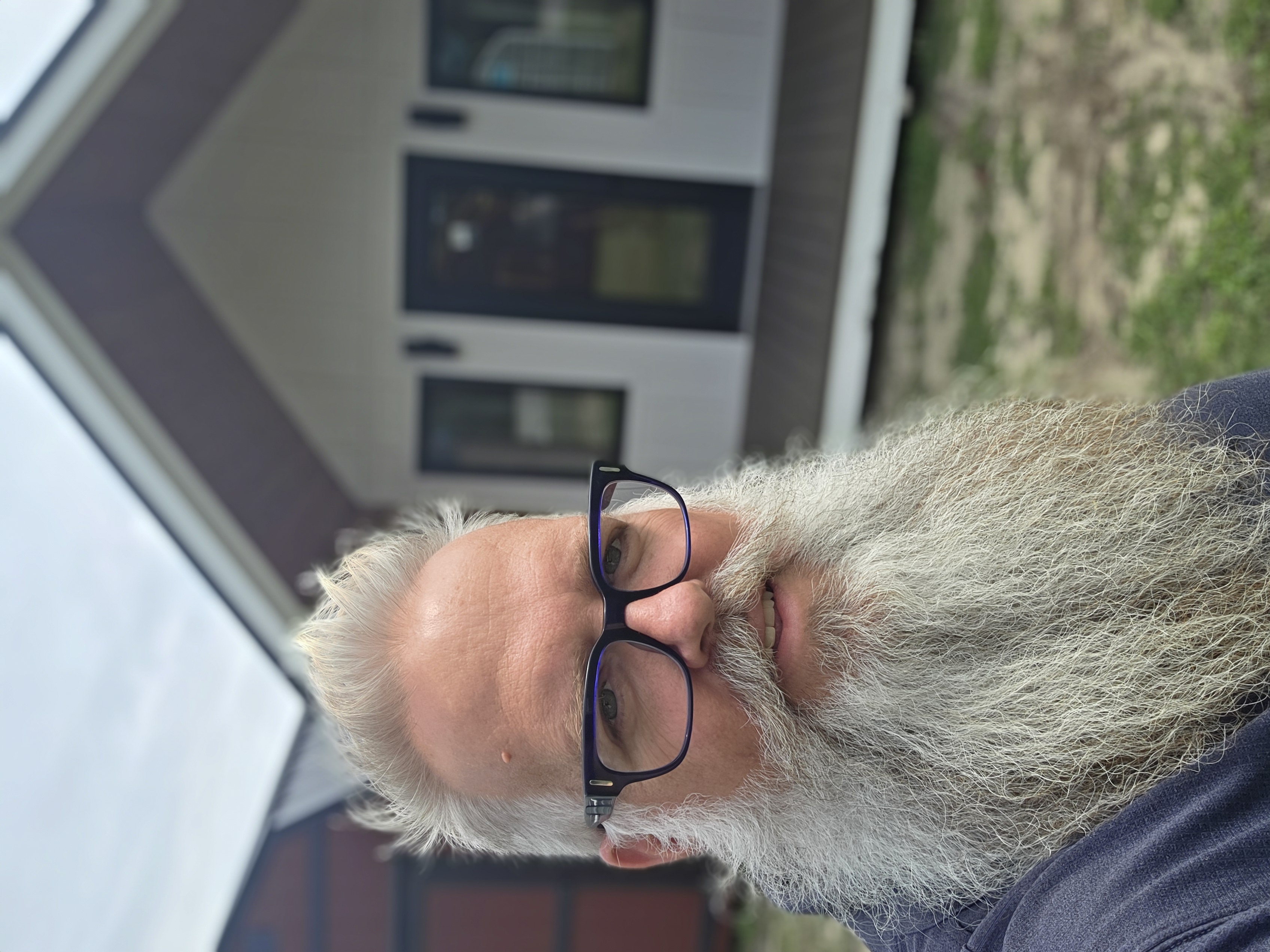 Bearded Bryan's Buildings and Barns team member helping a customer choose the right shed