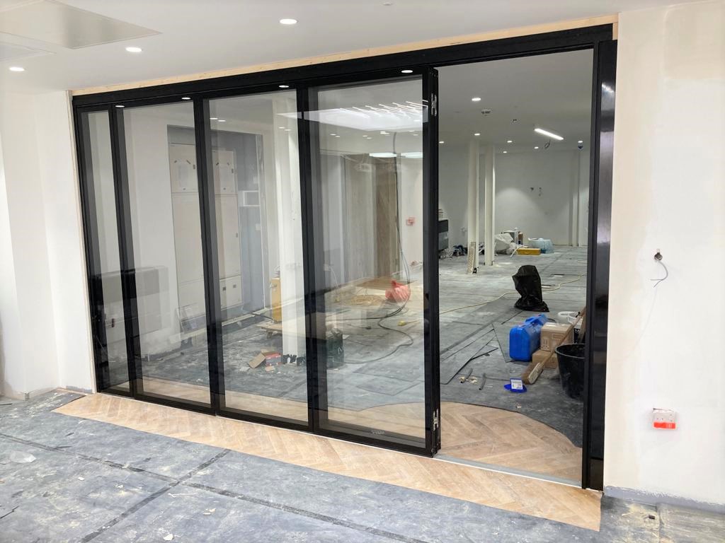MG500 Flush Glazed Sliding Folding Partitions – Office Fit-Out — movable acoustic wall installation 3