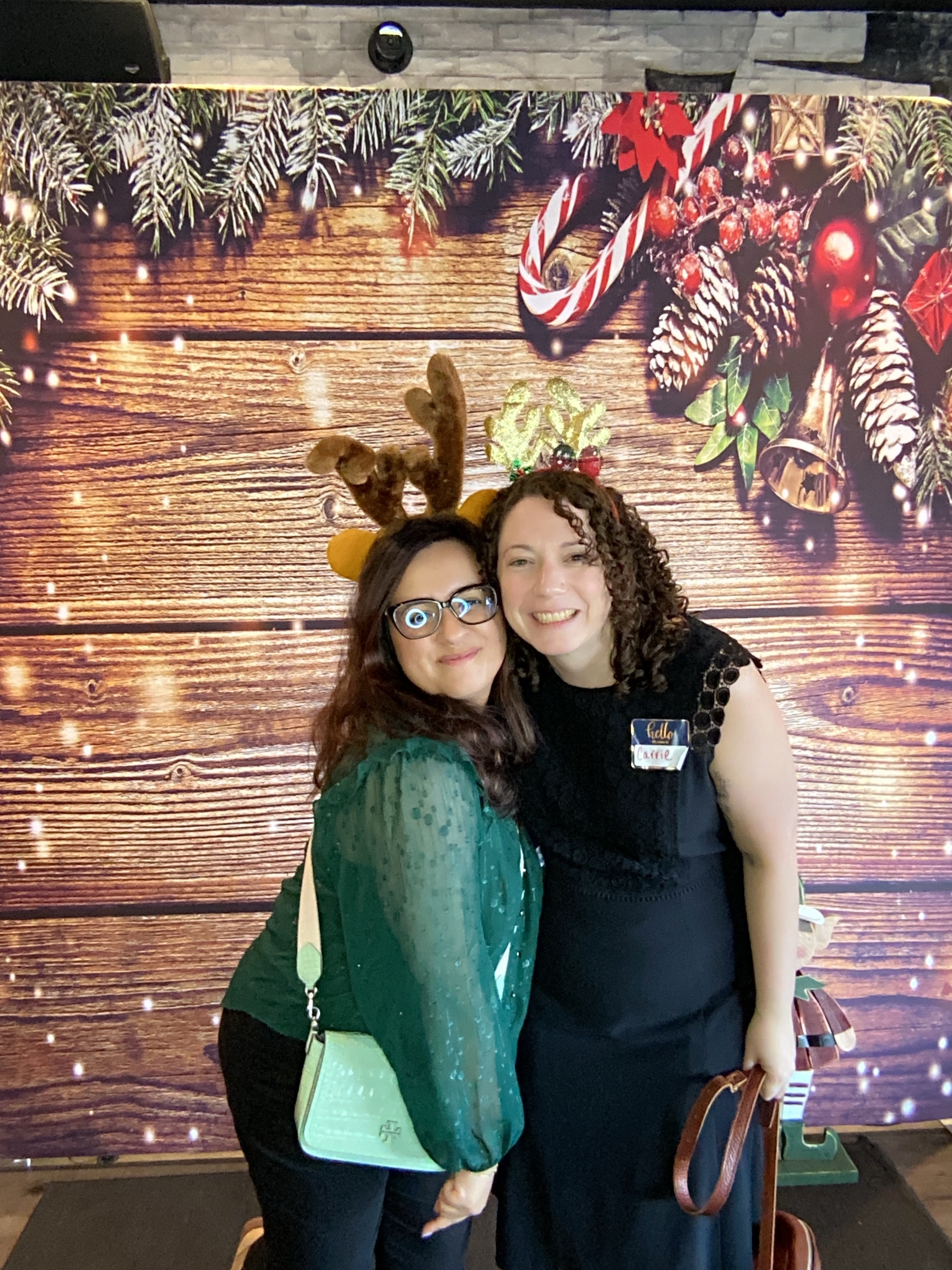 Group of guests celebrating at a holiday photo booth event in December 2025