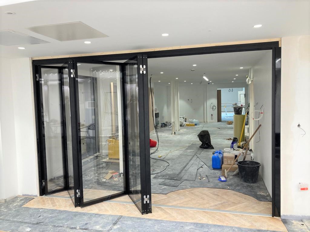MG500 Flush Glazed Sliding Folding Partitions – Office Fit-Out