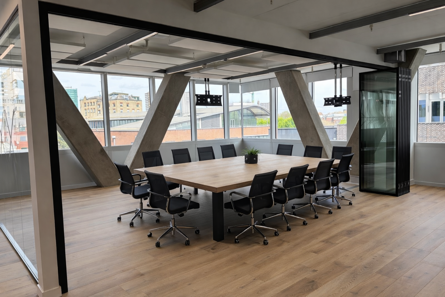 MG500 flush glazed partition panels in sliding folding configuration — slim aluminium framing with full-height glass at 2,700 mm