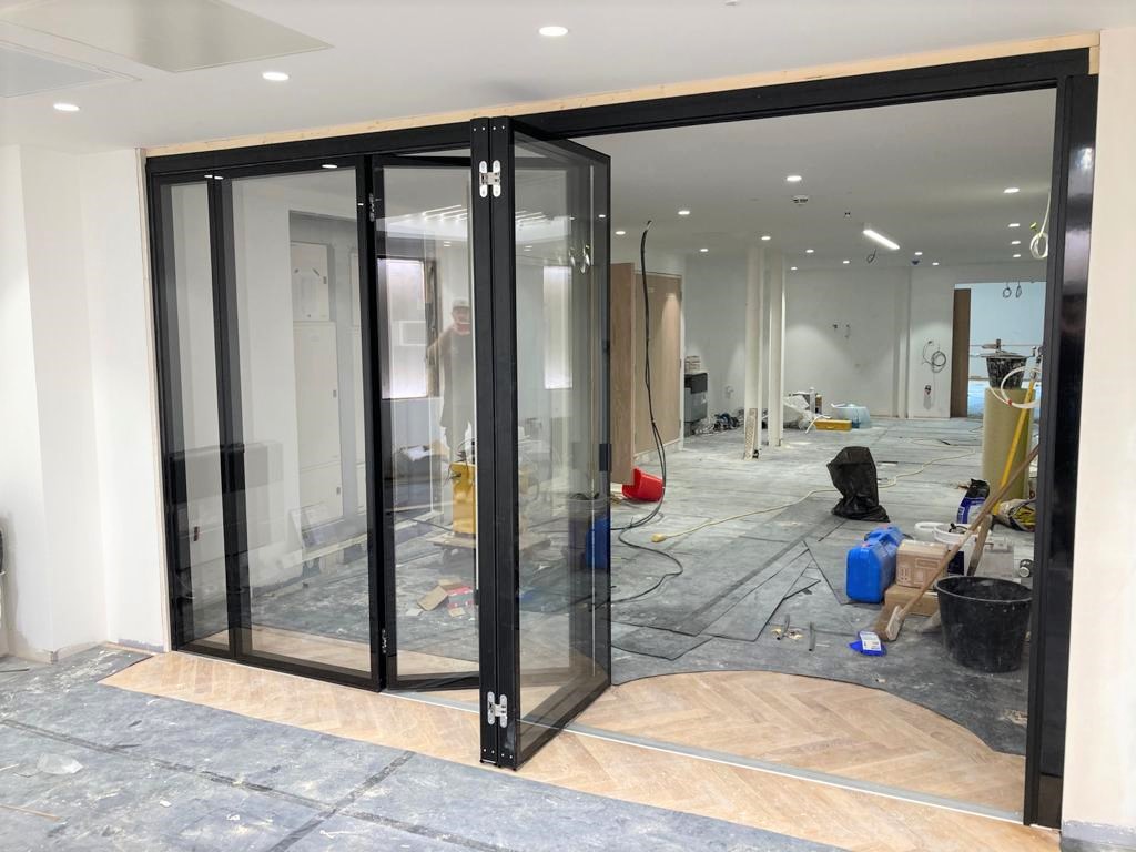 MG500 Flush Glazed Sliding Folding Partitions – Office Fit-Out — movable acoustic wall installation 2