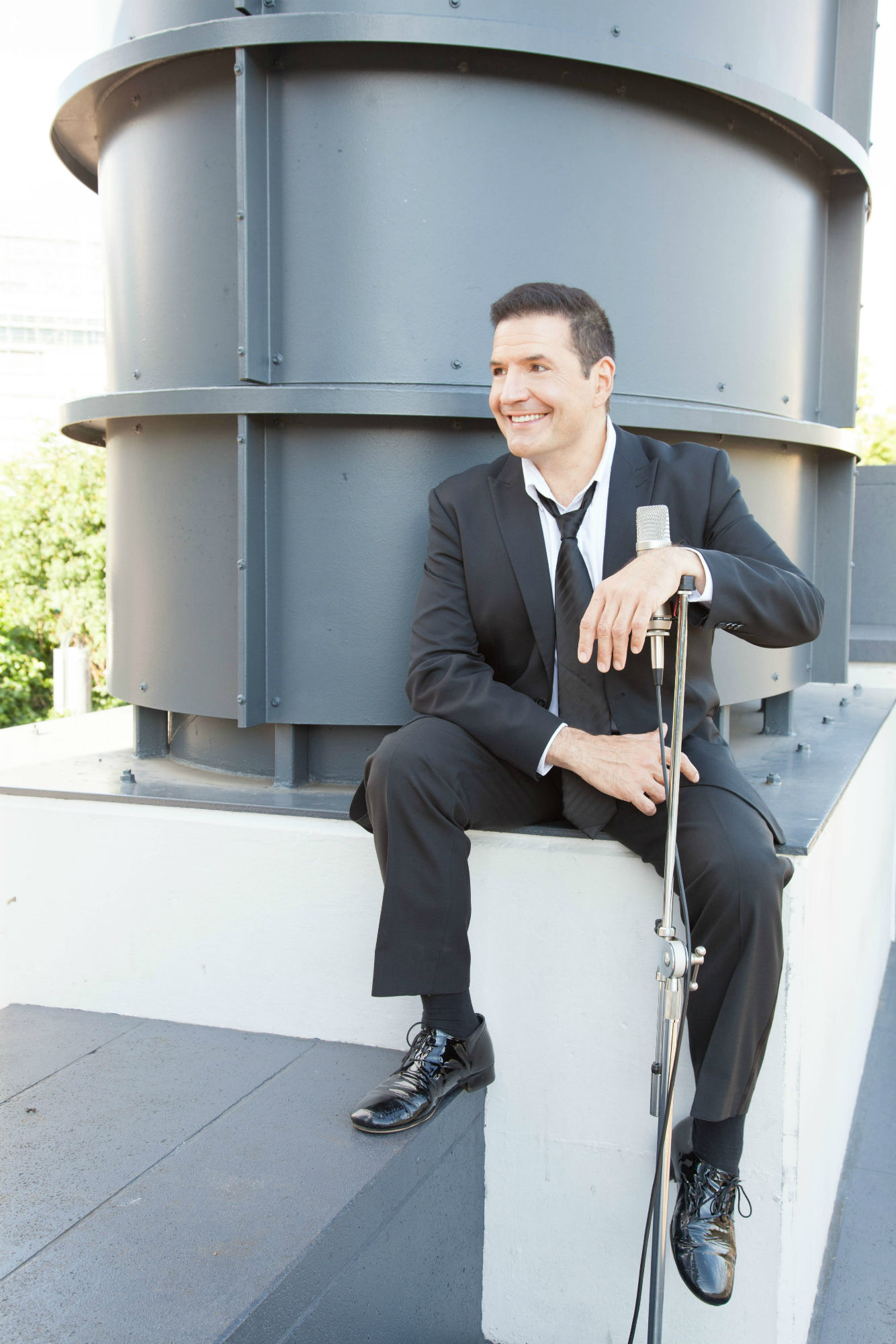 Mark Janicello, professional voice artist, in a recording studio