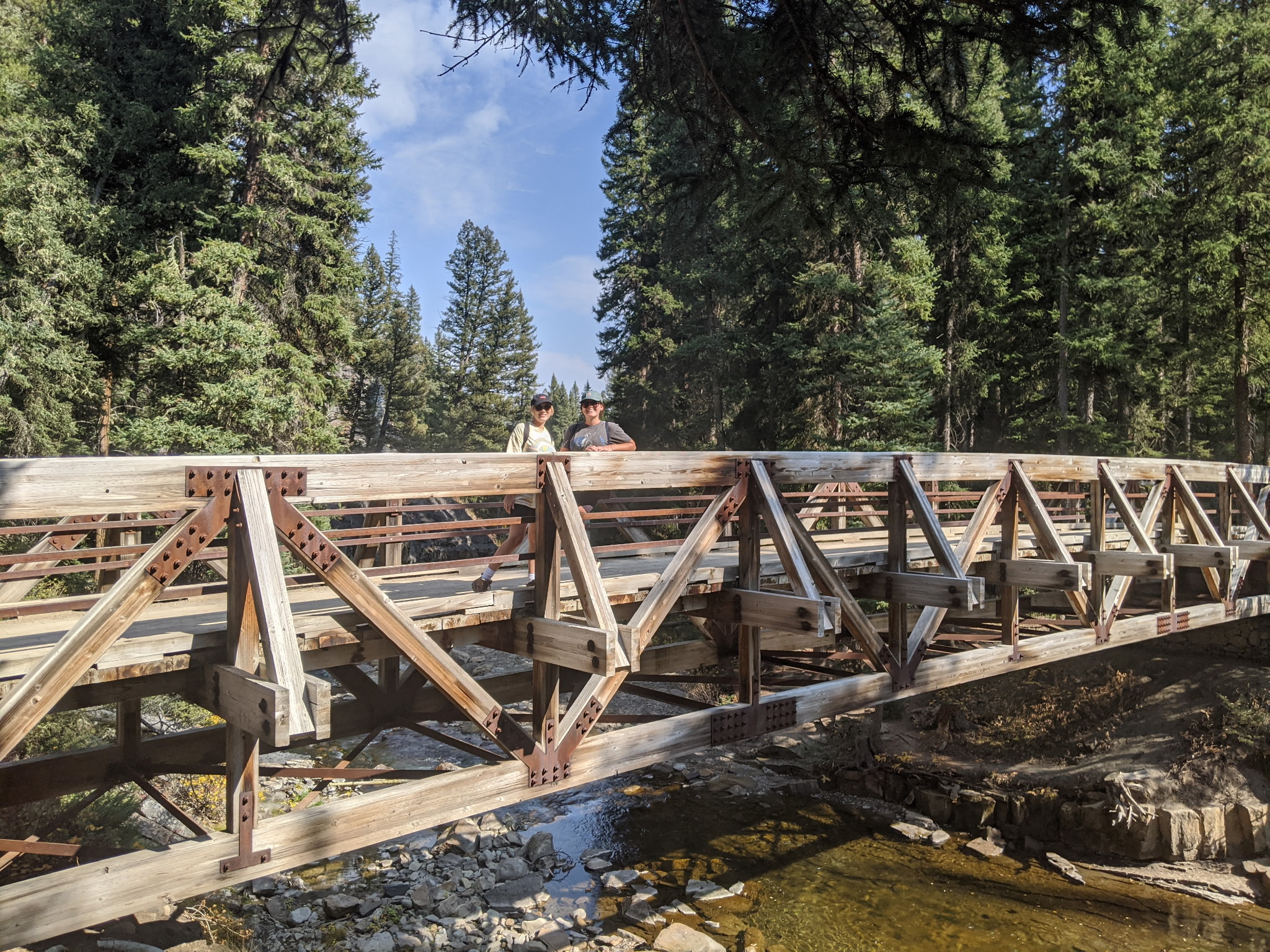 Ousel Falls waterfall near Big Sky Montana surrounded by pine forest