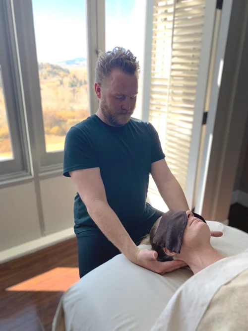 Neck massage in bright studio setting